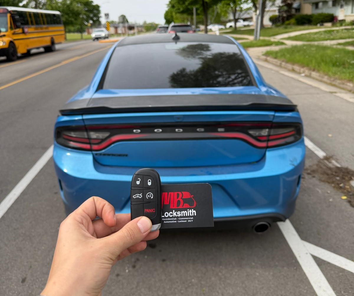 Emergency locksmith near me unlocking a car door in Kenosha