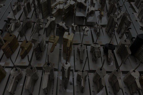 Wall‑mounted display of assorted key blanks organized by type — Milwaukee locksmith key cutting inventory.